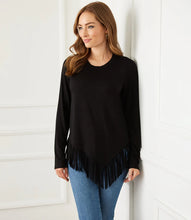 Load image into Gallery viewer, The fringe details on the hem of this super soft top cut from jersey-knit is just all that! A fashionable top our Blair can easily transition from day to evening.  Color- Black. Perfect coverage. Long sleeve. Round neck. Fringe hem.
