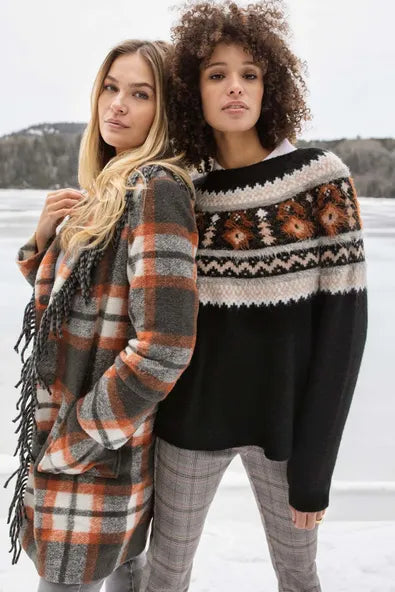 A snuggly sweater is a closet staple.  This soft intarsia knit piece offers a classic Fair Isle design, crew neckline, raglan sleeves, and relaxed fit that lends itself to endless, effortless outfit options.  Color- Black, grey, rust-orange, tan, white. Pop-over crew neck. Relaxed fit. Raglan sleeves. Soft intarsia knit.