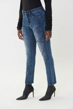 Load image into Gallery viewer, As unique as it is bold, our basic blue denim jean by Joseph Ribkoff is taken to new heights with its bold scribble pattern in black rhinestone embellishment.  A perfect statement piece to pair with your favorite top, you will definitely receive compliments on this fabulous jean.
