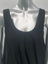 Load image into Gallery viewer, You need look no further for the perfect black sleeveless top because our Clea is the one!  A beautiful sheer flowy fabrication on the outside with a knit tank inside gives this style a perfect flair.  Black goes well with everything in your closet and this black top will pair beautifully with everything in your closet.
