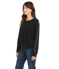 Load image into Gallery viewer, This super soft fleece sweatshirt will keep you cozy warm during those chilly days. Detailed with brass studs for a dash of edge, this embellished sweatshirt pairs perfectly with your favorite denim. Color- Black. Long sleeve. Round neck. Brass stud embellishment.
