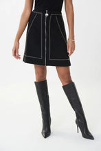 Load image into Gallery viewer, This gorgeous skirt with its magnificent details will get you noticed and give you numerous compliments.  With its zippered front and small silver rivet accents in a sleek pattern, this black skirt is elevated to new heights in design.    Color- Black. Fabric-96% Polyester. 4% Spandex.
