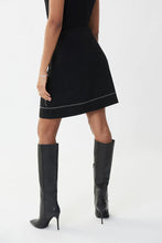 Load image into Gallery viewer, This gorgeous skirt with its magnificent details will get you noticed and give you numerous compliments.  With its zippered front and small silver rivet accents in a sleek pattern, this black skirt is elevated to new heights in design.    Color- Black. Fabric-96% Polyester. 4% Spandex.
