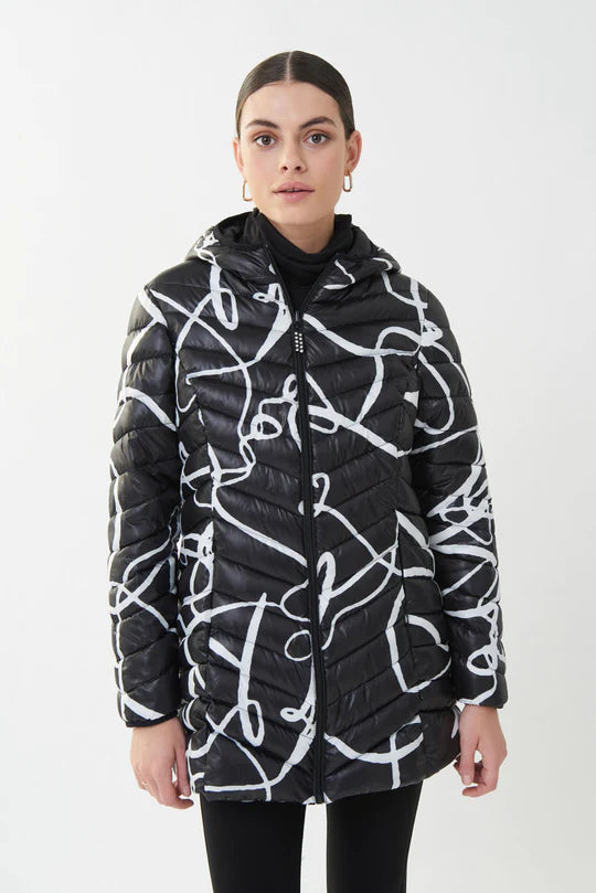 Keep warm and chic in this fabulous zipper puffer coat. With a stunning white abstract print that pops on a black background, concealed side pockets and hood, this a must-have for the season. Stand out in a crowd with this amazing style.