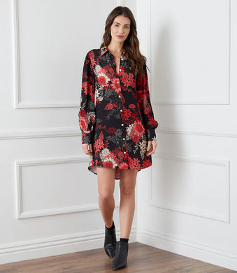 Vibrant florals in rosy hues bloom over this breezy shirtdress. So many different styling options are made possible with this stunning dress. Add a belt for an effortless look with neutral shoes- or wear it as a jacket unbuttoned with jeans and a simple top. Or pair with your favorite black leggings and tall boots.  So many endless possibilities!  Color- Red, black and white. Long sleeve button cuff. Slightly oversized.  Point collar Button down