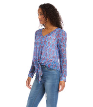 Load image into Gallery viewer, Various floral and shapes print in colorful blue and red hues brings this figure flattering tie front top to life. The addition of shimmering metallic lurex makes it the perfect way to dress up any outfit. Color- Red and blue. Long sleeve button cuff. V-neck. Tie-front.
