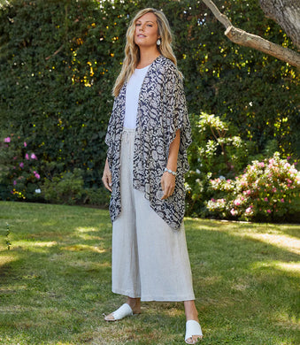 Designed to set a romantic tone, this lightweight kimono in a floral paisley print offers soft movement with its draped silhouette. Complete your layered look with this open front jacket for lightweight, stylish coverage.  Color- Brown and tan. Flare sleeve. Collarless. Floral print. Flowy and generous fit.  Medium/Large easily will fit an X-Large.