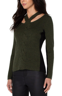 Featuring a neck wrap with cutout details and color blocking on the side, our Callie sweater makes for an amazing statement piece and a flattering silhouette. An effortless style, the Callie easily transitions from casual day wear to an evening out on the town.  Color- Pine heather and black. Cable twist design. Color blocking along the sides and down the inside of the arms. Neck wrap with cutout details