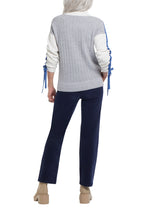 Load image into Gallery viewer, This stylish color block sweater checks all the boxes for fashion and function, and we can&#39;t wait to wear it all season long. We&#39;re loving the sleek mock neck, relaxed fit, and side slits, while the drop shoulder sleeves get a major makeover with contrasting ruched ties that you can style your own unique way.   Color- White, blue, and gray. Pop-over mock neck. Relaxed fit. Drop shoulder sleeves with contrasting ruching ties.
