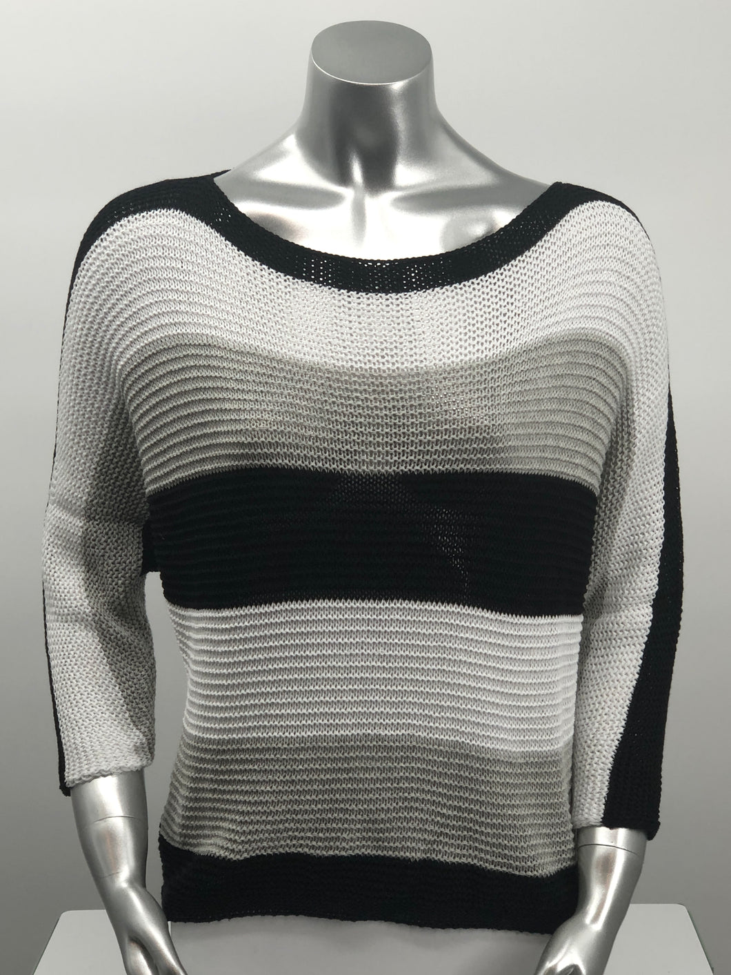 For those cool summer nights, or Caryl sweater is the perfect piece to keep warm.  Not too heavy and not too light, this knit sweater is fashionable and functional.  The colorblock colors in white, gray and black are so on trend and literally goes with so many different bottoms.  As this 3/4 sleeve sweater is not a tight knit, it is slightly see-through.  Wear over a bralette, tank or nude bra if preferred.  