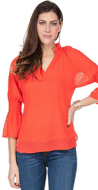 Our Carissa long sleeve top offers a feminine flair with its Swiss dot fabrication, elasticized sleeves and ruffle V-neck design. While the gorgeous sleeves are slightly sheer, the bodice is fully lined.  Wear with your favorite denim or dress up with a pair of white or black pants.    Color - Coral. Long, sheer sleeves. Fully lined bodice. Ruffle V-neck. Swiss Dot fabrication.