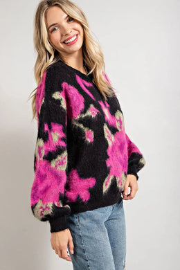 Make a statement in this bold floral pattern in vibrant colors.  A crew neck with puffed long sleeves add a hint of romanticism to this super fuzzy and soft sweater.  This is definitely a must have for your colder weather wardrobe.
