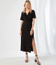 Load image into Gallery viewer, Simply elegant and classy is our Alicia Faux Wrap Midi Dress by Karen Kane.  A perfect evening-ready midi dress is designed and made from fluid jersey-knit fabric that offers an eye-appealing draping. A side-slit on the left side offers an even greater interest in this gorgeous midi dress.
