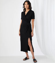Load image into Gallery viewer, Simply elegant and classy is our Alicia Faux Wrap Midi Dress by Karen Kane.  A perfect evening-ready midi dress is designed and made from fluid jersey-knit fabric that offers an eye-appealing draping. A side-slit on the left side offers an even greater interest in this gorgeous midi dress.
