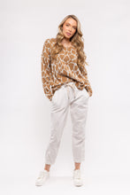 Load image into Gallery viewer, Animal print is so on trend and this darling sweater in beige giraffe print is very vogue! A beautiful piece to pair with so many of your favorite bottoms. You&#39;ll feel like safari fashionista when you put on this cozy warm sweater.  Color- Beige and white. Pull over.
