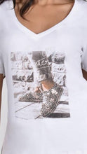 Load image into Gallery viewer, No matter how difficult times get, things always get better and our Faith tee by Frank Lyman reminds us of just that!   Not just an ordinary tee, this crisp white V-neck has the most darling design of two sneakers with bling and the saying &quot;It will get better.&quot;  When you wear this tee, your spirit will be lifted.  Wear under our Rita &quot;Love yourself first darling&quot; cardigan for a real positive vibe! As the tee has a more fitted design, we recommend sizing up one size.
