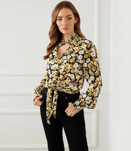 Load image into Gallery viewer, Add a dash of old-world romance to your wardrobe with our Fiona top with smocked sleeves, dramatic collar and tie front. With its unique design, this beautifully unique top can be dressed up or worn casually. You&#39;ll be sure to receive compliments when you style this beautiful top. Color-Black, white and gold. Long sleeve with smocked cuff. V-neck with smocked collar.
