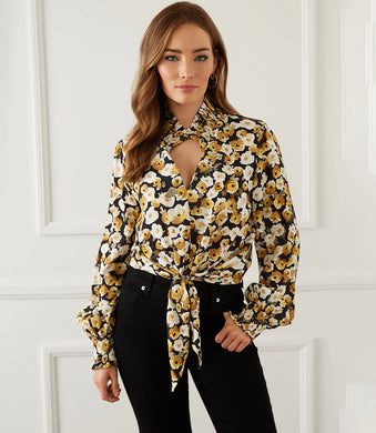 Add a dash of old-world romance to your wardrobe with our Fiona top with smocked sleeves, dramatic collar and tie front. With its unique design, this beautifully unique top can be dressed up or worn casually. You'll be sure to receive compliments when you style this beautiful top. Color-Black, white and gold. Long sleeve with smocked cuff. V-neck with smocked collar.