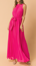 Load image into Gallery viewer, A stunning fuchsia color on this magnificent dress is all that and the design is a classic that will never go out of style.  Our Tanya dress has baby pleats and features a round neckline with baby ruffled edge. The Maxi has a self-sash tie and back keyhole button closure. Stand out from the crowd this summer in a dress that will definitely turn heads!
