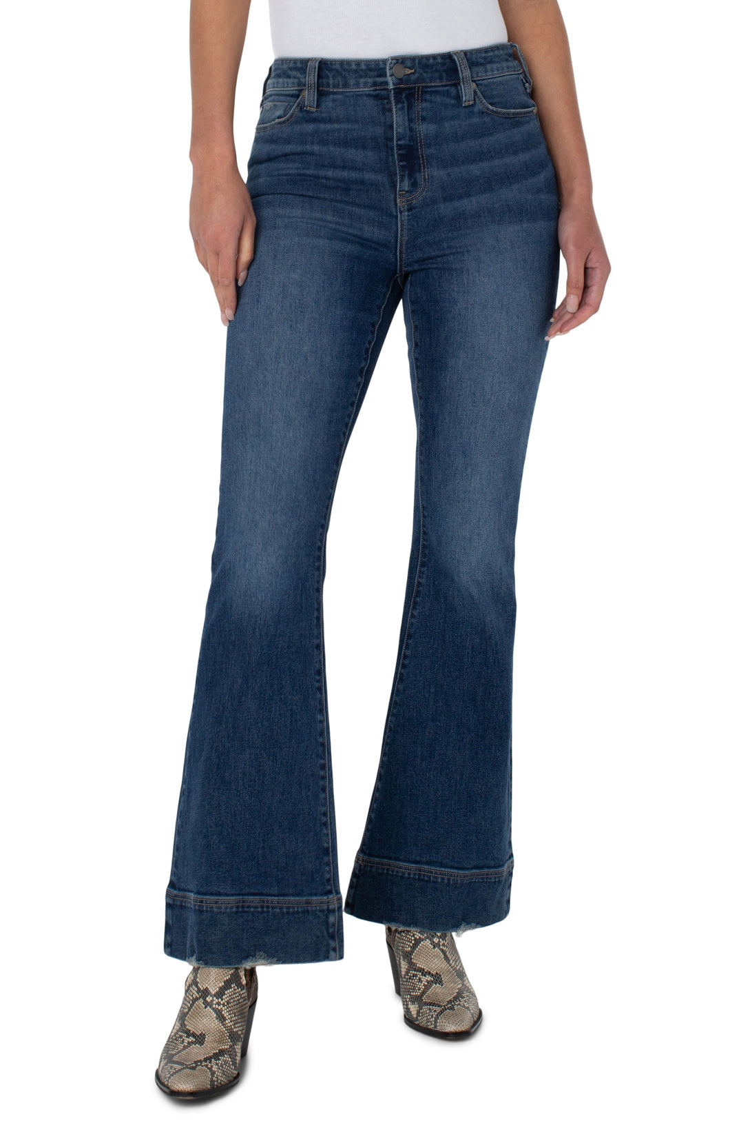 Our Hannah High Rise Flare Jean offers a flattering fit with just the right amount of edginess! The Hannah in a must-have Chatfield wash features a wide hem, a slimmer fit through the thighs and flares at the bottom creating a beautiful bootcut/flare shape.  This modern eco jean was designed using new laser techniques and processes that uses a fraction of our natural resources.  Color- Chatfied. 34'' Inseam Hi-Rise 11-1/8