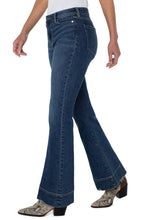 Load image into Gallery viewer, Our Hannah High Rise Flare Jean offers a flattering fit with just the right amount of edginess! The Hannah in a must-have Chatfield wash features a wide hem, a slimmer fit through the thighs and flares at the bottom creating a beautiful bootcut/flare shape.  This modern eco jean was designed using new laser techniques and processes that uses a fraction of our natural resources.  Color- Chatfied. 34&#39;&#39; Inseam Hi-Rise 11-1/8&quot; Front rise; 24-1/2&quot; Leg opening Sleek and sophisticated look.
