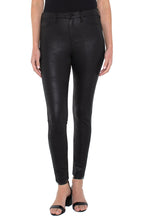 Load image into Gallery viewer, The signature Madonna legging in a black coated knit offers a classic look with a bit of edge with its subtle shine! Unique and classy, these leggings will look stunning paired with any top. Incredible comfort, the Madonna legging fits true to size, stretches with every movement but has fabulous recovery and does not end up bagging.  Stand out in a crowd with these attention-grabbing leggings! You will not be disappointed!  Color- Black. 29&#39;&#39; Inseam. Hi-rise.
