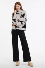 Load image into Gallery viewer, A cozy sweater is a must-have for cool weather, and we&#39;re currently obsessed with this playful printed double-knit style. A slightly cropped length, boxy fit, and draped cowl neckline have us excited to add this to our regular wardrobe rotation.  Color- Light camel, black and very slight yellow brushstrokes. Pop-over cowl neck. Boxy fit. Drop shoulder. Slightly cropped length. Soft intarsia knit.
