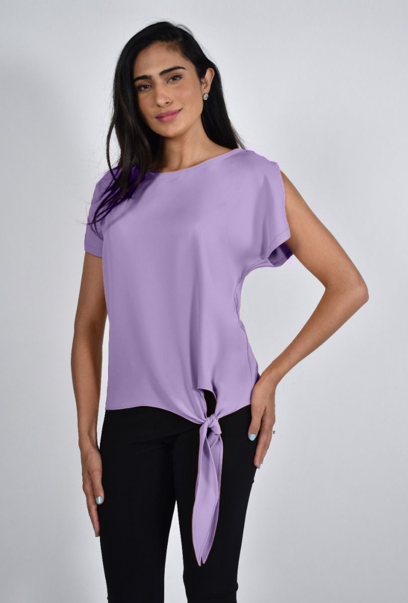 A gorgeous light lavender color top, our Iris top is an easy pull over fit with a side tie and split cap sleeve that adds a bit of flair.  Pair with your favorite pant or jean.   Our Iris looks stunning when paired with our LYLA LAVENDER AND BLACK ABSTRACT PRINT PANT - FRANK LYMAN  226468 (Pictured) Color- Iris; light lavender Pull-over. Relax fit. Split cap sleeve.