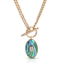 Load image into Gallery viewer, There are statement necklaces, and then there is this striking abalone piece. Shimmering colors pop on this pendant while a crystal baguette accent glimmers with each movement. This lovely necklace is just as unique as you.
