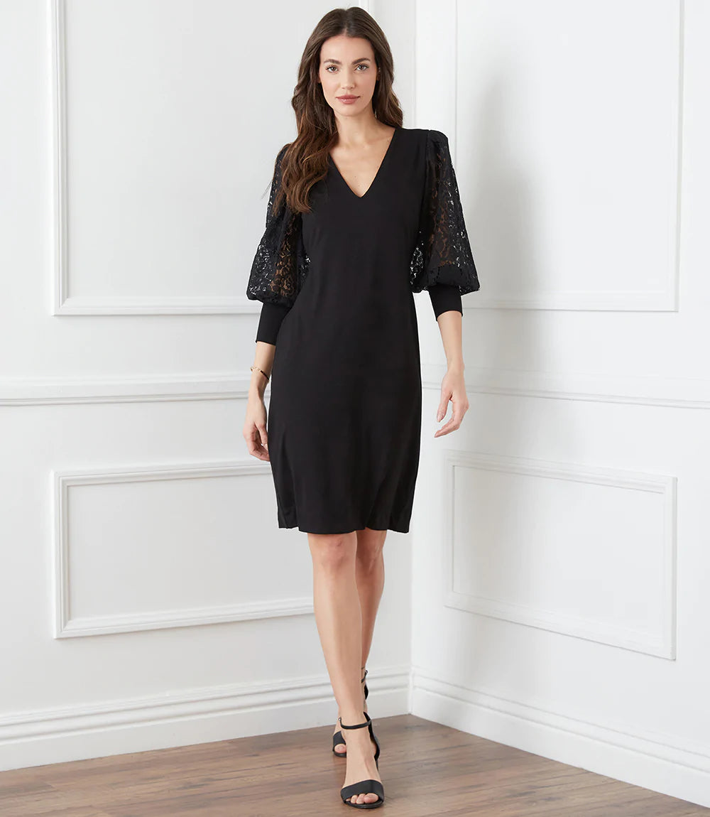This stunning black dress is elevated to a whole new level with beautiful airy lace sleeves. This curve-defining dress is cut from soft jersey-knit for a comfortable, evening look. Pair with tall black boots or your favorite pair of heels. Color- Black. Blouson lace sleeve. Center back invisible zipper. Sheath silhouette. V-Neck.