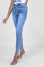 Load image into Gallery viewer, We love a jean that is beautifully unique.  This jean is lovely shade of blue with a raw edge hemline adorned with just a peek of lace and rhinestone trim and topped off with a rhinestone and white pearl button.  Look and feel chic when you wear this fabulous jean by Frank Lyman.  Color- Blue and white. Rhinestone and pearl button and lace detail. Raw edge hemline. Pockets. Button and zipper closure.
