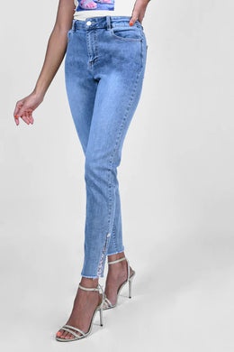 We love a jean that is beautifully unique.  This jean is lovely shade of blue with a raw edge hemline adorned with just a peek of lace and rhinestone trim and topped off with a rhinestone and white pearl button.  Look and feel chic when you wear this fabulous jean by Frank Lyman.  Color- Blue and white. Rhinestone and pearl button and lace detail. Raw edge hemline. Pockets. Button and zipper closure.