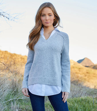 Consider this the ultimate classy sweater: wear it dressed-up or-down any day of the week. Just the right amount of a white shirt at the collar and hem provides the illusion that this one-piece long sleeve top may actually be two. 