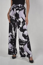 Load image into Gallery viewer, Get noticed when you wear this fabulous abstract pattern pant in lavender and black.  A gorgeous, belted jersey knit palazzo is an easy pull-on style.   Style with our beautiful IRIS SIDE TIE TOP - FRANK LYMAN  181224. (Pictured)  Colors - Lavender and Black. Palazzo pant Pull-on. Abstract print. Belted. Unlined.
