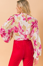 Load image into Gallery viewer, Our Ashley floral blouse is both sophisticated and fun!  A stunning abstract floral print in pink and taupe on a white base gives this blouse an edge, while billowy sleeves offer a feminine appeal.  Gathering at the collar, sleeves and shoulders add that extra flair.  Effortlessly pair this blouse with jeans for a casual look or dress up with your favorite bottoms.

