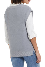 Load image into Gallery viewer, The hottest trend this season is a sweater vest over a long sleeve shirt.  Our Silvia sweater vest in grey mix is the perfect style to show off this trend! V-neck, wide band hem and cap sleeve design gives this sweater vest ultimate flair. Layer over our WYLER WHITE ROLL UP SLEEVE SHIRT (pictured) for the perfect trendsetting look!   Color- Grey mix. V-neck design. Wide band hem.
