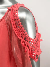 Load image into Gallery viewer, A vibrant coral color really pops on this flowy, beautiful Casey Coral Top by M Made In Italy. The design details are spectacular with crochet split short sleeves.  The flowy fabric on the outside of a solid tank offers a feminine touch.  A little drama, a little romance, this solid hue pairs perfectly with almost everything in your closet.
