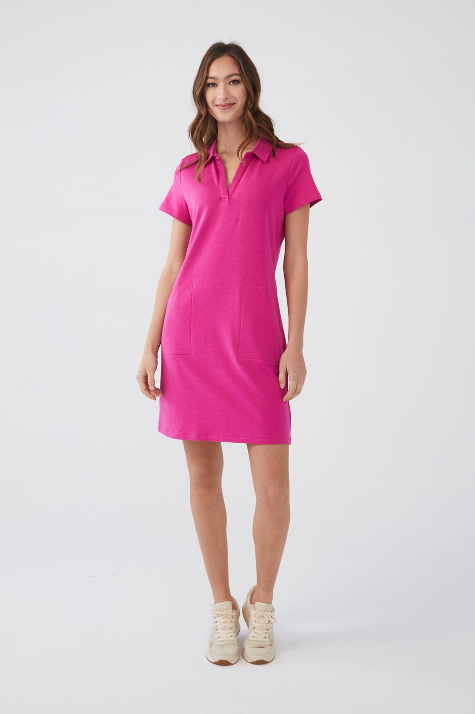 An everyday essential, our polo dress in a brilliant magenta color is an easy and comfortable style for almost every occasion. Whether you are going to the grocery store or a golf session during your vacation, this is the dress you will want to wear again and again.  Color- Magenta Pull-over. Polo style. Short sleeve.
