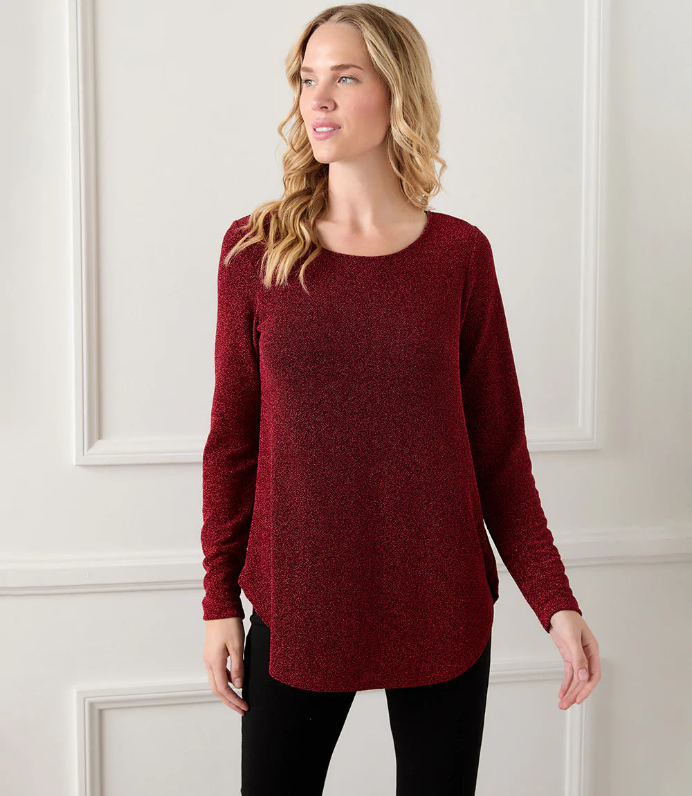 Standout in this knit top that sparkles with shimmering metallic threads. Pair it with black slacks for a polished holiday look. Color- Red. Long sleeve. Scoop neck. Sparkle knit.