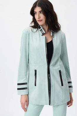 Simply stunning is this gorgeous mint faux suede jacket designed by Joseph Ribkoff.  With its polished and classic design and amazing color, you will definitely get noticed when you style this jacket.  Black faux zipper detailing along the neckline, sleeves and front creates an appealing contrast against the mint background. The longer length provides excellent coverage.  