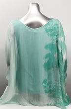 Load image into Gallery viewer, Imagine wearing this incredible top at an outdoor party or out to dinner with friends. A glorious flowy fabrication creates a stunning tunic in a mint tie dye pattern.  Create a classy and fashion forward look with this tunic by pairing it with white bottoms or black slacks.  
