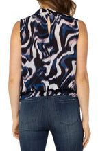Load image into Gallery viewer, This beautiful floating ink printed top in nautical blue, black, white and soft pink is a fabulous statement piece featuring a mock neck slit and smocked waistband. With a great fit, providing all day comfort, our Mandi can be worn alone or under your favorite jacket or blazer.  An outstanding outfit includes this top paired with your favorite white bottom.  Color- Floating Ink; Blue, black, white and soft pink. Split front. Sleeveless. Banded elastic bottom. Blousy design. Not stretch fabrication.
