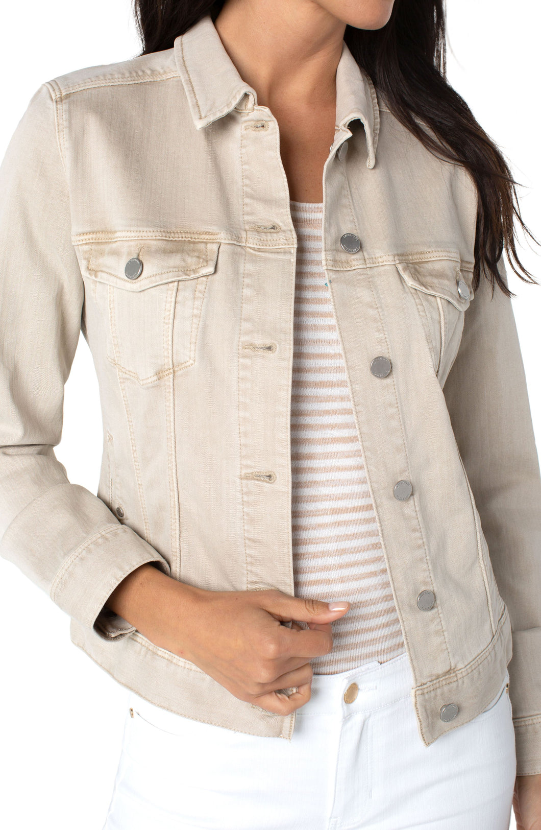 You need this perfect classic denim jacket in Monterey sand color. A jacket for all seasons, our Mandy has amazing stretch and recovery. You'll find this style becomes your go to layering item for everyday outfits.   Color- Monterey Sand- Light tan. Silver buttons and hardware. Amazing stretch and recovery. Slub stretch twill.