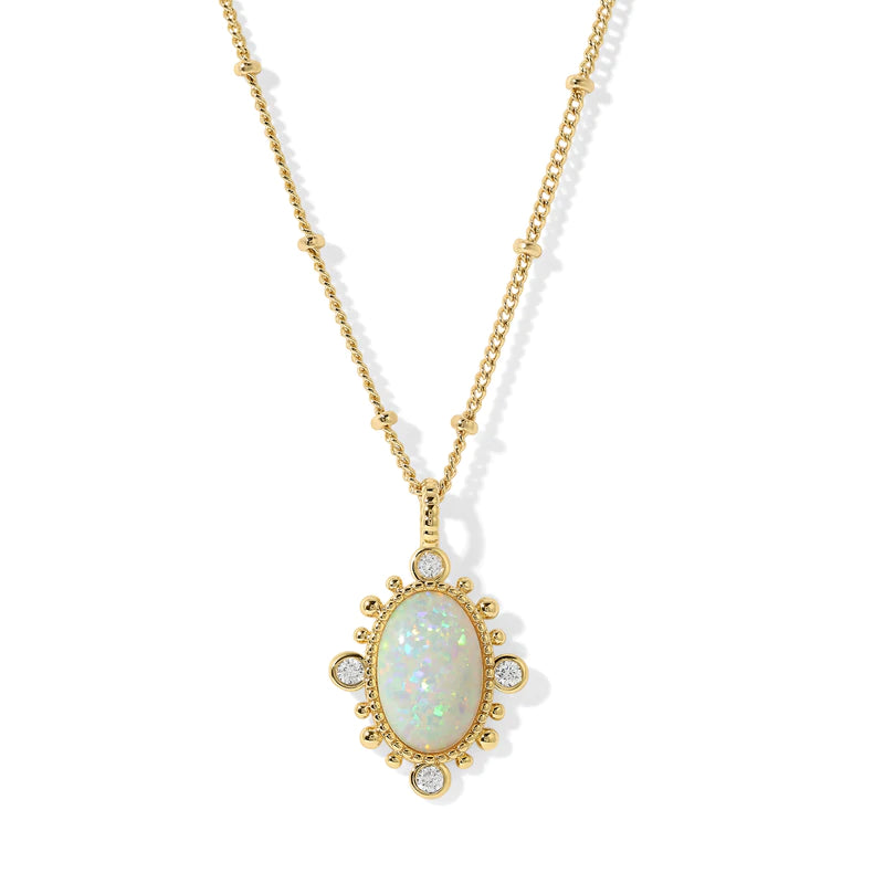 A gorgeous design on the New Lourdes Opal Necklace creates a lovely pendant that can be worn for all occasions. A gorgeous oval opal is surrounded by gold detailing and four cubic zirconia.  The intricate chain has small gold beading.  The beauty is in the details and our New Lourdes necklace is a beauty in its own right. 