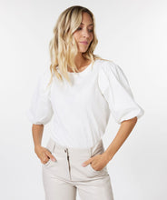 Load image into Gallery viewer, We love the elevated take on a simple t-shirt.  The blouson sleeves are a spectacular feature on our Odelia, creating a feminine and stylish look.  Be prepared to receive compliments when you style this top with your favorite bottom.  Color- Off-white. Pull-over. Bodice is t-shirt stretch material.  Sleeves are more of a crisp cotton fabrication. Fabric-100% Cotton.
