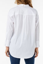 Load image into Gallery viewer, Our Odeline classic white button-down shirt is a timeless essential that needs to have a place in your closet!  A perfect style that goes from season to season, you will be amazed at the fabulous stretch on this poplin shirt!  Color- White. Button-front closure. Left front pocket. Hi-low hem detail. Wide cuff detail with button closure. May size down if in between sizes.  Fabric-65% Cotton. 32% Polyester. 3% Spandex.
