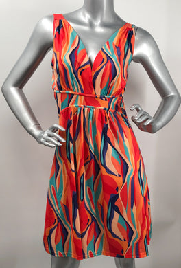 Nothing says summer like a vibrant multi color Grecian dress.  Simply breathtaking in design and ultra-cool fabrication with a satiny feel, this dress will be the focal point of any summer event.  A fabulous dress to take on vacation, it is easy to wear and can be worn for so many occasions.  You'll look just like a goddess in this stunning style!