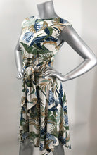 Load image into Gallery viewer, An absolutely gorgeous dress, our Winslow White Tropical dress drapes beautifully and is figure flattering.  A white background comes alive with a tropical fern print and is enhanced with a gorgeous, attached tie that can be tied in the front or back.  Worn to lunch or a night out.  This gorgeous summer dress will make a fashion statement.  
