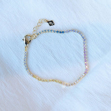 Load image into Gallery viewer, A beautiful tennis bracelet with perfect pops of pastel, the Gracie is a lovely piece that can be layered or worn alone.  Our Gracie bracelet  will easily become your new favorite for the Spring/Summer.  Add our Gracie Pastel Tennis necklace for extra sparkle!  Colors- Clear, pink, blue, yellow and gold. Length -6.5&quot; with a 1.5&quot; extender. Cubic zirconia. 14k gold plating over brass.
