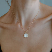 Load image into Gallery viewer, Featuring a carved mother of pearl inlay with Mary silhouette in center, this pendant is perfect to pair with the classic mother Mary necklace.  Color- Gold and white Genuine mother of pearl shell. Gold ball vermeil chain. Chain length -16&quot; + 2&quot; extender. 
